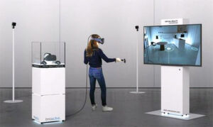 Das Virtual Reality Showroom-Konzept von Innoactive Digital Realities umfasst alle Bestandteile, die für einen flächendeckenden Einsatz von VR-Technik zur Produktpräsentation nötig sind – einschließlich eines Displays für die Zuschauer. Das Virtual Reality Showroom-Konzept von Innoactive Digital Realities umfasst alle Bestandteile, die für einen flächendeckenden Einsatz von VR-Technik zur Produktpräsentation nötig sind – einschließlich eines Displays für die Zuschauer.