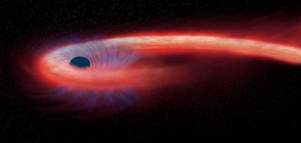 Diese von der NASA bereitgestellte künstlerische Darstellung zeigt einen Stern, der von einem schwarzen Loch geschluckt wird und dabei einen Schweif aus Röntgenstrahlen, dargestellt in rot, abgibt. Japanische Wissenschaftler haben nahe dem Zentrum der Milchstraße ein lange vermutetes Schwarzes Loch von mittlerer Größe aufgespürt. Diese von der NASA bereitgestellte künstlerische Darstellung zeigt einen Stern, der von einem schwarzen Loch geschluckt wird und dabei einen Schweif aus Röntgenstrahlen, dargestellt in rot, abgibt. Japanische Wissenschaftler haben nahe dem Zentrum der Milchstraße ein lange vermutetes Schwarzes Loch von mittlerer Größe aufgespürt.