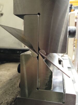 A press brake is a machine tool for bending sheet and plate material, most commonly sheet metal. It forms predetermined bends by clamping the workpiece between a matching punch and die. A press brake is a machine tool for bending sheet and plate material, most commonly sheet metal. It forms predetermined bends by clamping the workpiece between a matching punch and die.