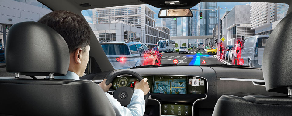 Basierend auf der Technologie des holografischen Wellenleiter erlaubt das neue Head-up-Display eine größere Projektionsfläche bei gleichzeitiger Reduktion des Einbauvolumens. Basierend auf der Technologie des holografischen Wellenleiter erlaubt das neue Head-up-Display eine größere Projektionsfläche bei gleichzeitiger Reduktion des Einbauvolumens.