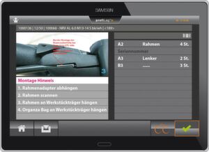 Die Displays an den Montageplätzen zeigen genau an, wann welcher Handgriff zu erledigen und welches Bauteil anzubringen ist. Die Displays an den Montageplätzen zeigen genau an, wann welcher Handgriff zu erledigen und welches Bauteil anzubringen ist.
