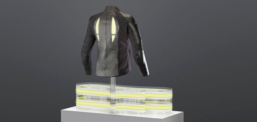 In der Jacke eines Motorradfahrers sorgt die OLED für Sicherheit im Straßenverkehr. Dank leiitfähigen Garnen wird die OLED mit Energie versorgt. In der Jacke eines Motorradfahrers sorgt die OLED für Sicherheit im Straßenverkehr. Dank leiitfähigen Garnen wird die OLED mit Energie versorgt.