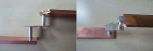 Messaufbau mit zwei Bolzen (im Bild versilberte ISA-CON 450-Bolzen), die einen Shunt-Widerstand kontaktieren, fungieren als stromleitende Verbindungselemente. Messaufbau mit zwei Bolzen (im Bild versilberte ISA-CON 450-Bolzen), die einen Shunt-Widerstand kontaktieren, fungieren als stromleitende Verbindungselemente.