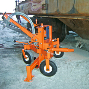 The height-adjustable Martin Engineering Railcar Opener can accommodate different car gate designs and variations in unloading platforms. The height-adjustable Martin Engineering Railcar Opener can accommodate different car gate designs and variations in unloading platforms.