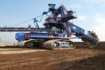 Fig. 1: Sandvik's compact bucket wheel excavator delivered to Hungary has a total height of 24 metres and a total weight of 1650 tonnes. The 12 metre diametre bucket wheel delievers 6700 cubic meter per hour of loose material – a total capacity of 12 million bank cubic metres and tonnes per year.